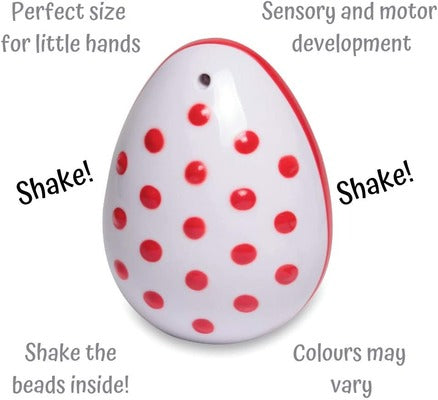 White egg-shaped shaker toy with red polka dots and text describing sensory benefits and internal beads.