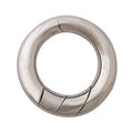 Silver metallic ring-shaped puzzle with a thick polished band and slanted interlocking segment lines.
