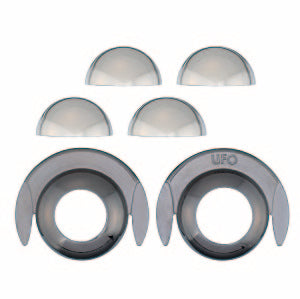 Six dark metallic grey puzzle pieces including four domes and two winged rings, one embossed with UFO, on white.