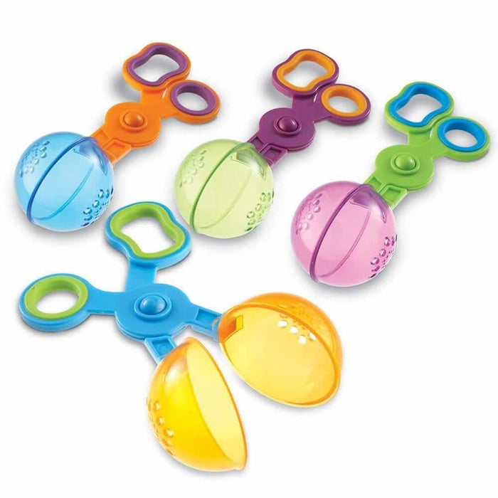 Four colorful scissor-action scoopers with translucent spherical ends and finger loops for fine motor play.