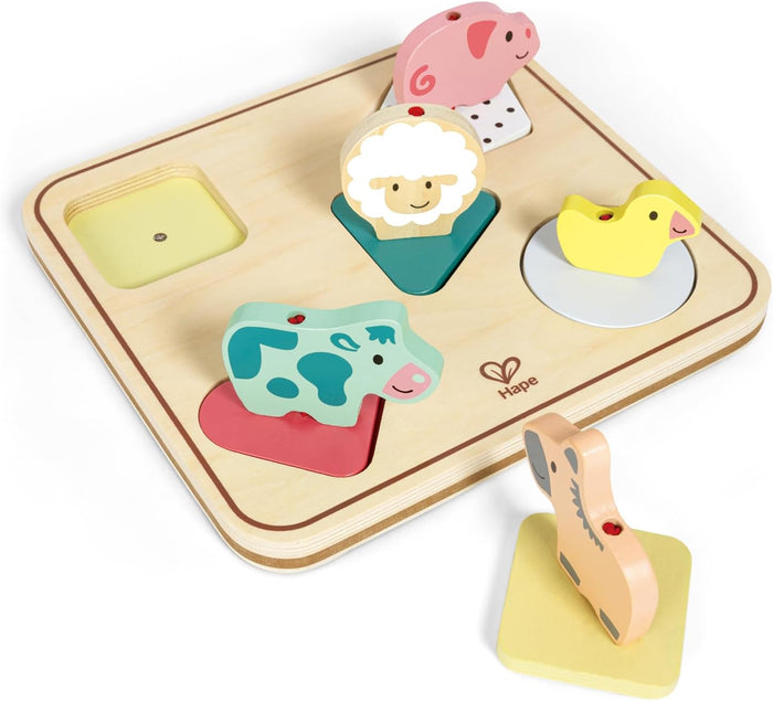Wooden farm animal puzzle with five colorful pieces on shaped bases, including a pig, sheep, duck, cow, and horse.