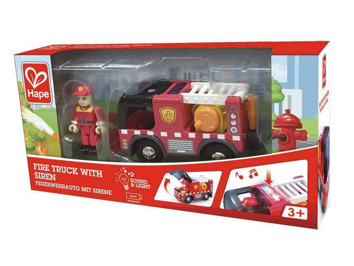 Red toy fire truck and firefighter figurine in Hape box showing siren sound and light features for ages 3+.