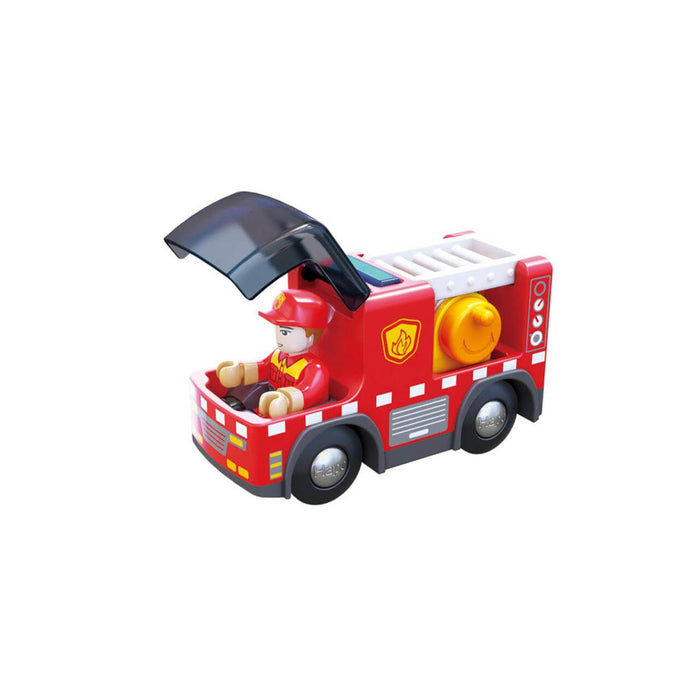 Red toy fire engine with a white ladder, yellow hose reel, and a firefighter figure in the open cockpit.