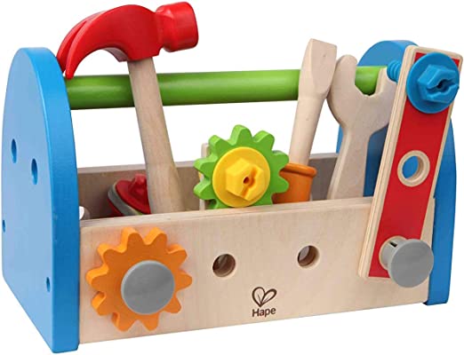 Wooden toy toolbox with blue sides, green handle, red hammer, wrench, screwdriver, and colorful gears and bolts.