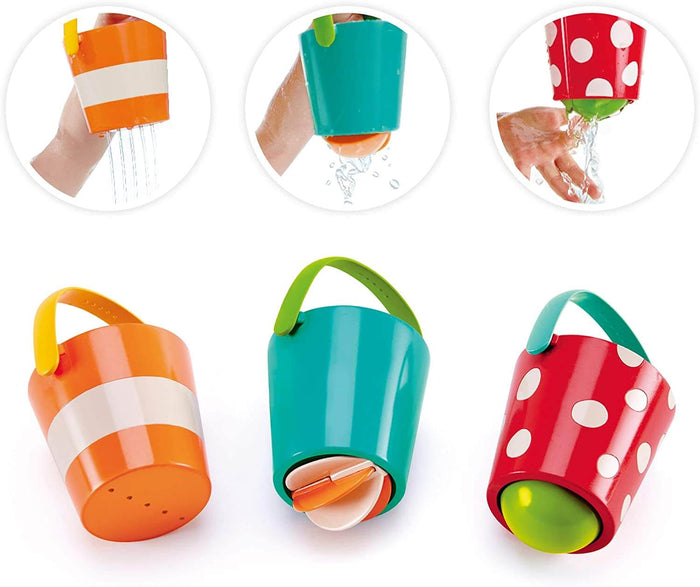 Three colorful toy bath buckets—orange stripes, teal, and red polka dots—demonstrating various water-pouring effects.