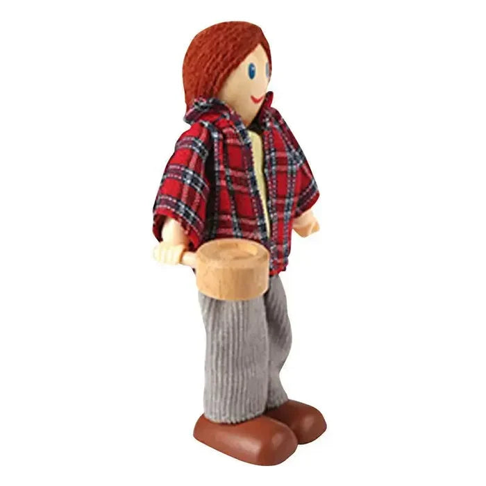 Poseable wooden doll with red yarn hair, red plaid shirt, grey pants, and brown shoes holding a wooden pan.