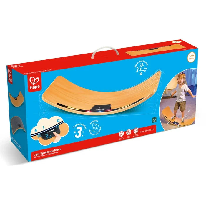 Blue and red box showing a curved wooden balance board with built-in lights and a boy playing.