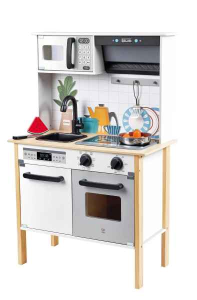 Modern wooden play kitchen in white and light wood with a microwave, sink, stovetop, oven, and play accessories.