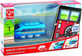 Blue toy train engine in red and white packaging with a clear window, app interface graphics, and charging icons.