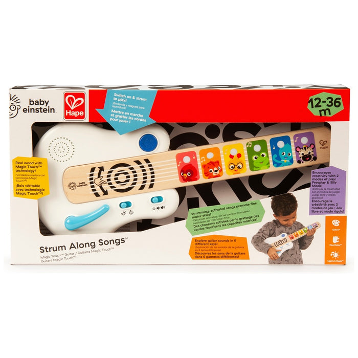 White and wood baby guitar toy in box with colorful animal buttons and blue whammy bar.