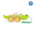 Green wooden crocodile pull toy with orange wheels, a segmented body, and a green pull string.