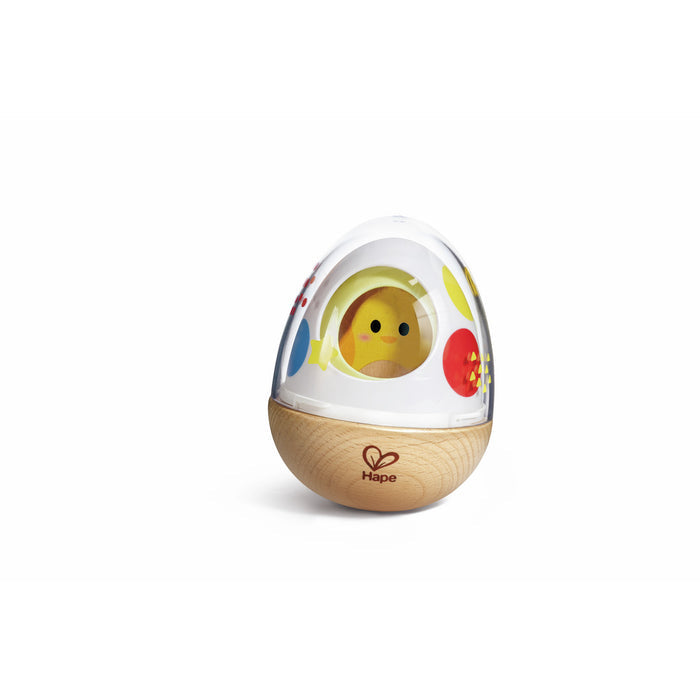 Egg-shaped wooden wobble toy with a clear dome, yellow chick inside, and colorful polka dots.