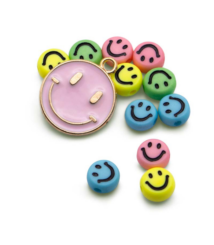 Large pink enamel smiley face charm with small colorful round smiley beads in yellow, green, pink, and blue.