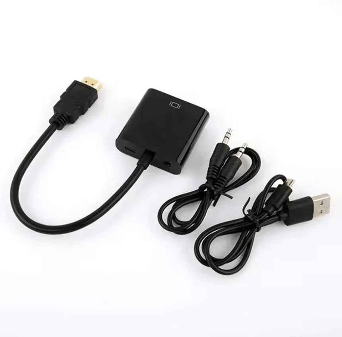 Techplus HDMI to VGA converter adapter with audio and USB ports, showing the compact black device connected to cables.