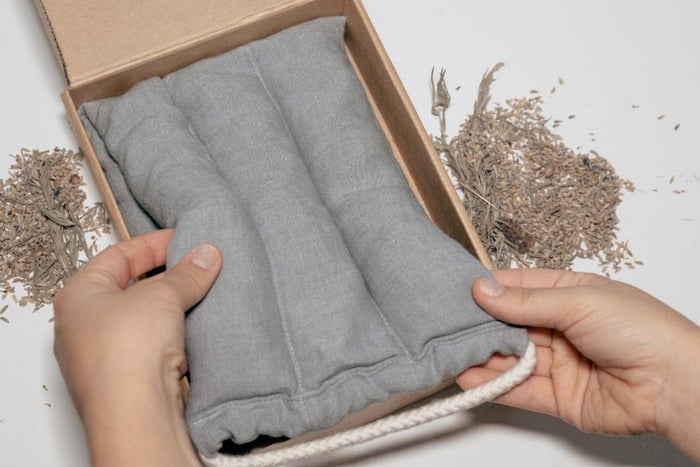 Natural heat and cold pack by Do Not Disturb Sleep Company, soft fabric cover and flexible gel interior for soothing therapy.