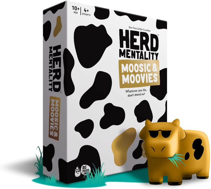 White game box with black cow spots beside a golden-brown cow figurine wearing sunglasses and chewing grass.