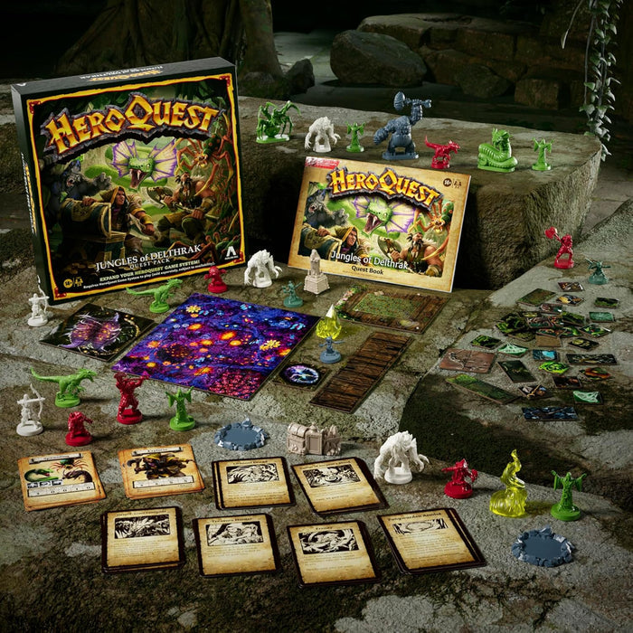 HeroQuest expansion box, quest book, cards, and red, green, and white plastic miniatures on a mossy, rocky surface.