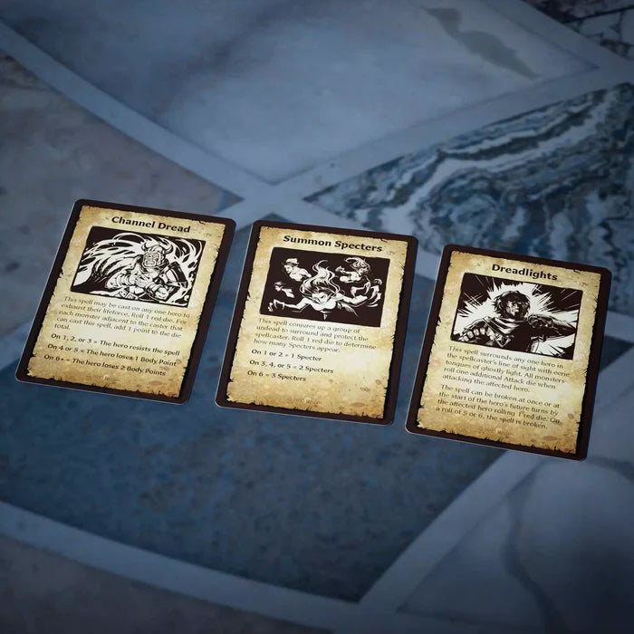 Three weathered parchment cards with black and white art on stone: Channel Dread, Summon Specters, and Dreadlights.