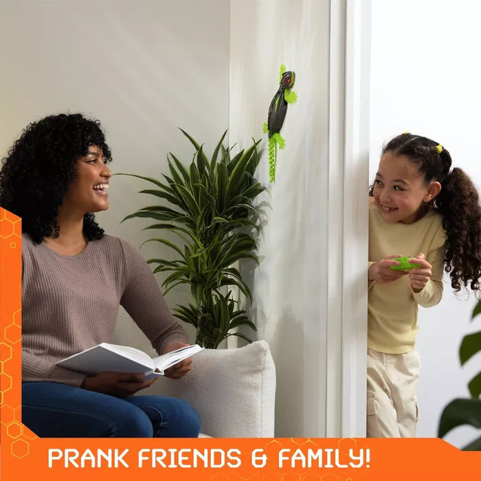 Neon green and black toy gecko crawls up a wall while a girl hides with a remote control to prank a woman.