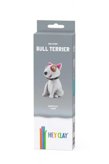 Grey packaging for Hey Clay featuring a white clay bull terrier model with a brown eye patch and pink ears.