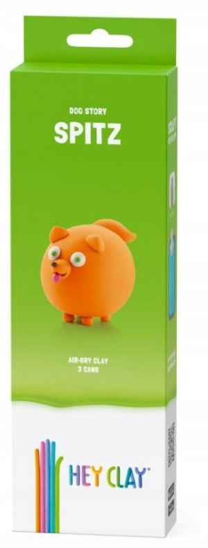 Green and white box for Hey Clay Spitz, featuring a round orange clay dog with wide eyes and a pink tongue sticking out.