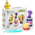 Minions clay kit with a white box, yellow and purple figures, blue tools, and colorful stacked clay containers.