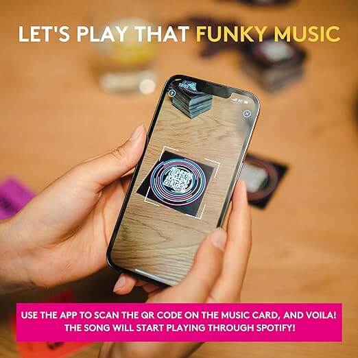 Smartphone scanning a neon pink and blue circular QR code on a music card to play songs via Spotify.