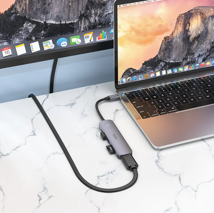 Techplus Hoco PD 100W USB-C 6-in-1 adapter hub with multiple ports including HDMI, USB-A, and SD card slot, on a white background.