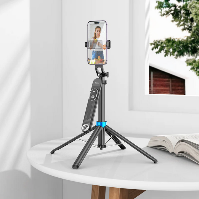 Techplus Hoco Premium Bluetooth Selfie Stick with 1.75m extendable pole and quadpod stand, shown in use for selfies and photos.