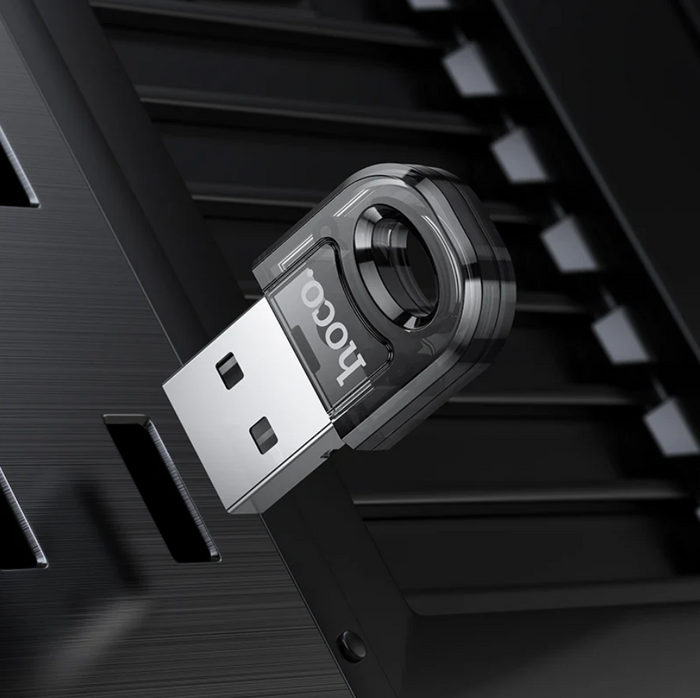 Techplus Hoco USB Bluetooth receiver adaptor wireless dongle plugged into a computer port, enabling Bluetooth connectivity.