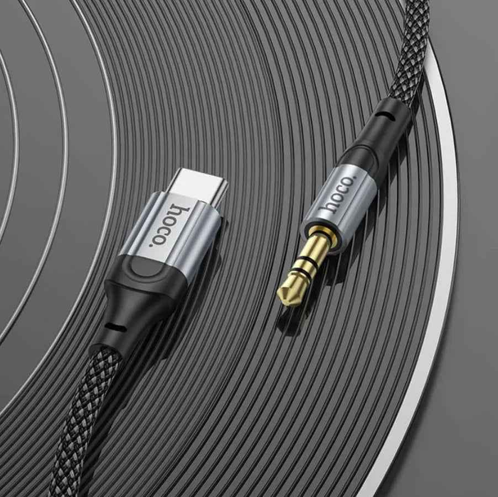 Techplus Hoco USB-C to 3.5mm aux cable connected to a device, showing compact design and durable cable for audio connectivity.