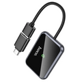 TechPlus Hoco Wireless CarPlay Adapter USB-A to USB-C converter connected to a vehicle's USB port for seamless smartphone integration.