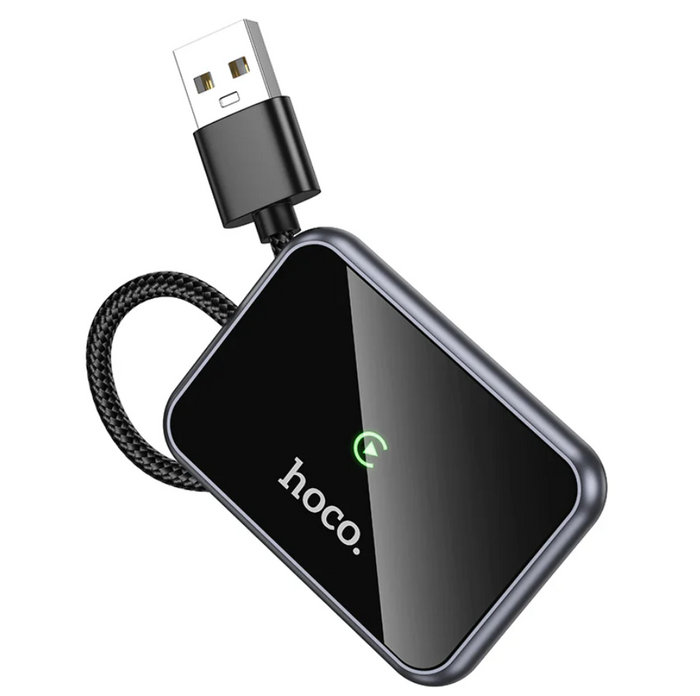 Techplus Hoco Wireless CarPlay Adapter USB-A to USB-C converter connected to a car dashboard for seamless iPhone integration.