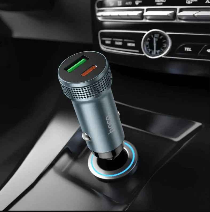 Techplus Hoco Z49B dual-port car charger with 38W USB-C PD and USB-A QC fast charging ports, shown plugged into a vehicle's dashboard.
