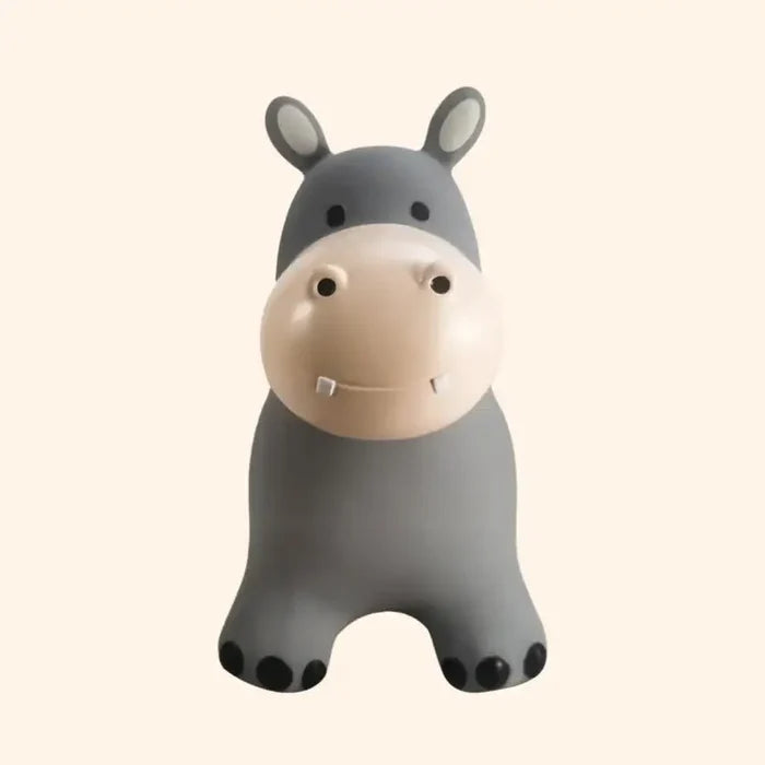 Gray inflatable hippo toy with a large cream snout, small white teeth, and black toenails on four thick legs.