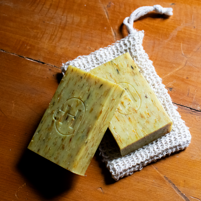 Holistic Hound Grooming Bar by Animal Addiction Limited, 120g, natural soap bar with a textured surface for pet grooming.