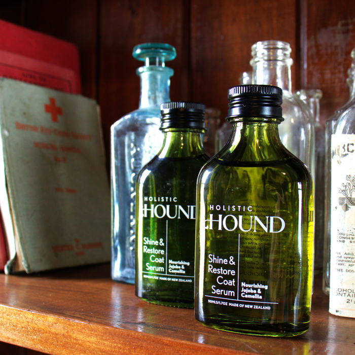 Holistic Hound Shine & Restore Coat Serum for dogs, 50mls, with a clear bottle showing the serum inside.