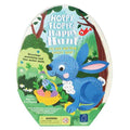 Egg-shaped game box featuring a blue bunny holding a basket of colorful carrots in a green forest setting.