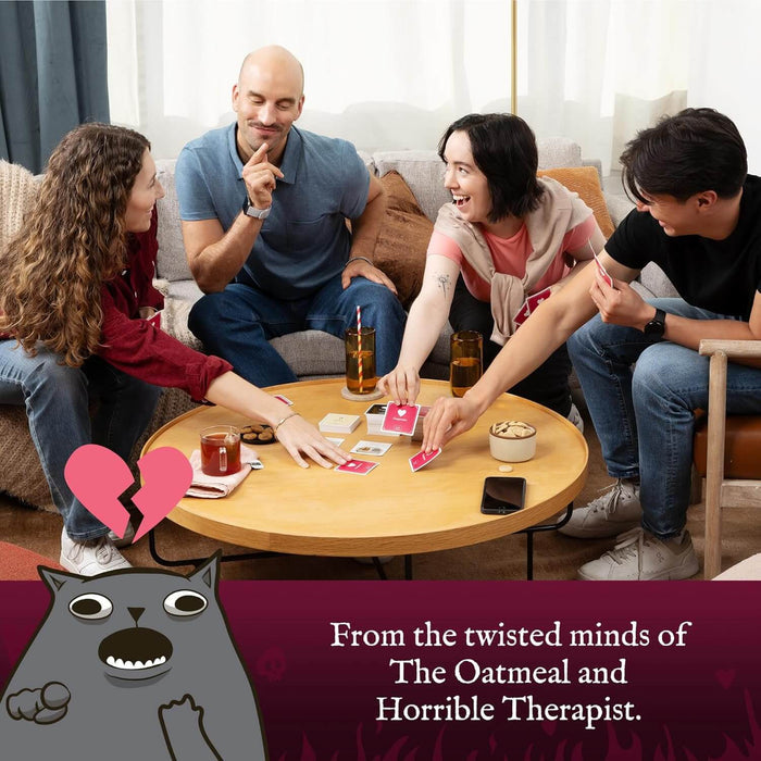 Four friends play a card game at a round table. A grey cartoon cat and broken heart are in the foreground.