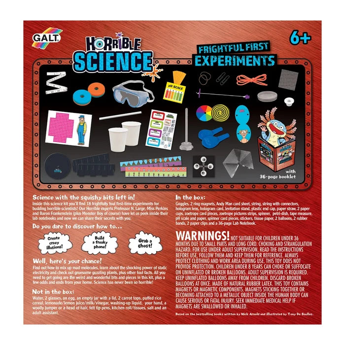Red and black science kit box displaying components like goggles, magnets, and a lab notebook with a cartoon monster.