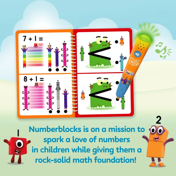 Math activity book with Numberblocks characters and an interactive yellow pen that glows green when touching a dot.