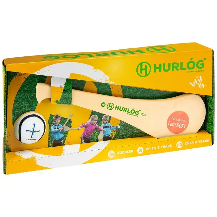 Soft cream foam hurley and white ball with black cross in a yellow and green box featuring photos of kids playing.