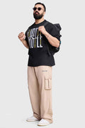 Black Hustle oversized T-shirt by Fuaark NZ, casual fit with bold front graphic, short sleeves, and relaxed style.