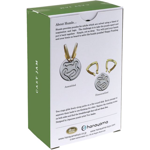 Green and white box back showing a silver grooved disc puzzle with two gold rings, assembled and disassembled.