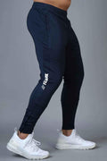 Fuaark Nz Hybrid Slim Tracks in navy, a sleek athletic track pants with a modern fit and sporty design.