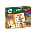 Educational reading game box with colorful letter tiles, word cards, and a portable board for spelling exercises.