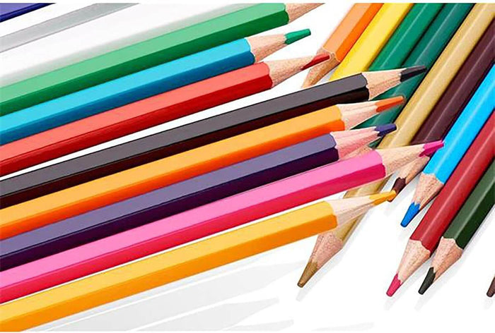Assorted vibrant hexagonal colored pencils with sharpened tips arranged diagonally on a white background.