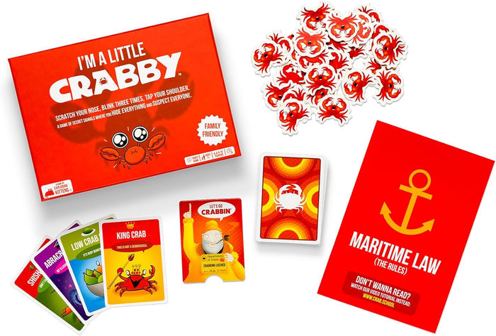 Red I'm A Little Crabby game box with illustrated playing cards, a rulebook, and many small crab-shaped tokens.