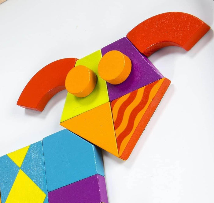 Colorful geometric wooden shapes like arches, circles, and triangles arranged into a face on a white background.