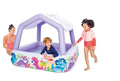 Purple inflatable square pool with a sunshade roof and colorful dinosaur graphics on the side.